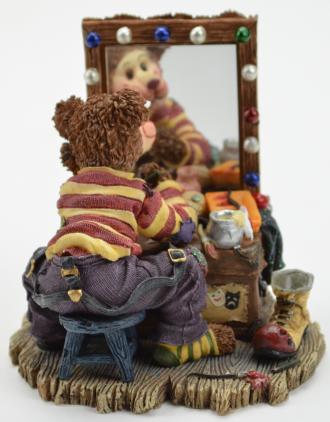 clown boyds bear looking into a mirror before the big show